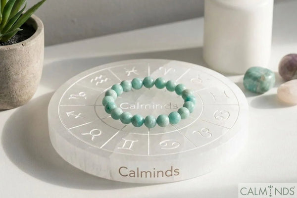 Crystal bracelet and polished crystals on a charging plate indoors