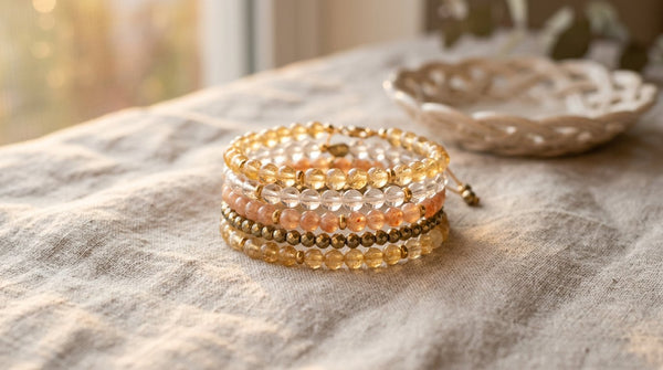 Lion's Gate Portal crystal bracelet stack in warm sunrise light